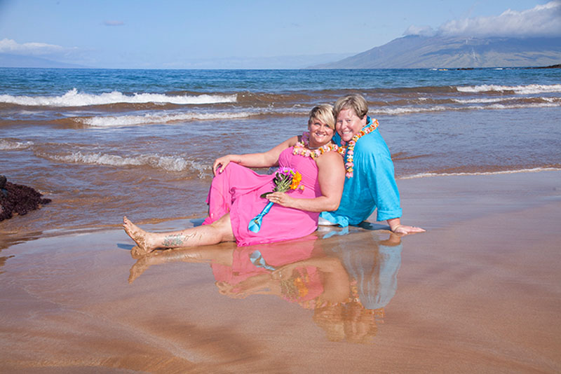 ladies in pink and blue dress at maui wedding