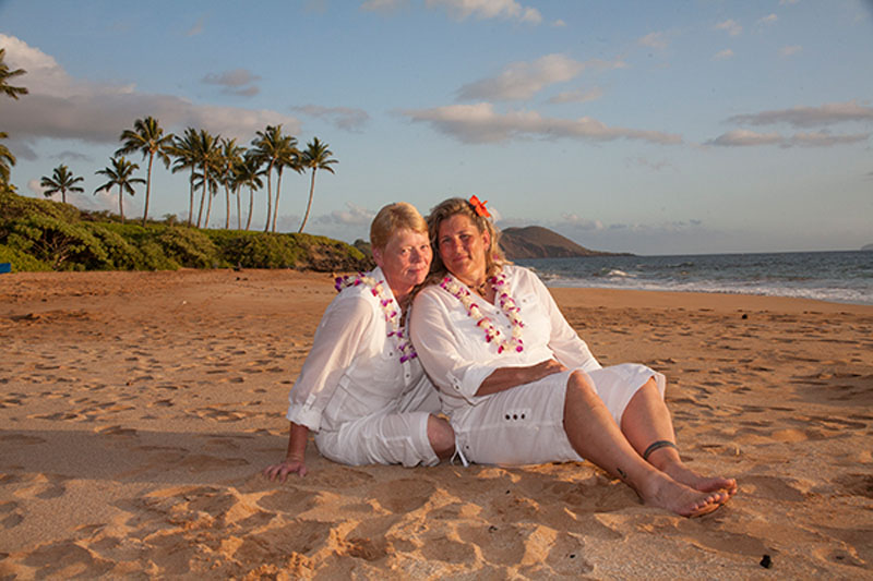 ladies sitting on the beach